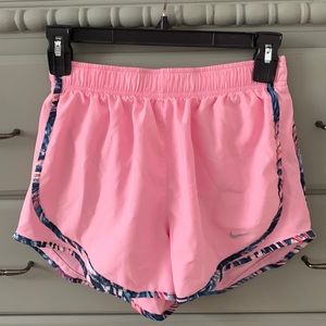 Like new pink Nike running shorts with floral detail